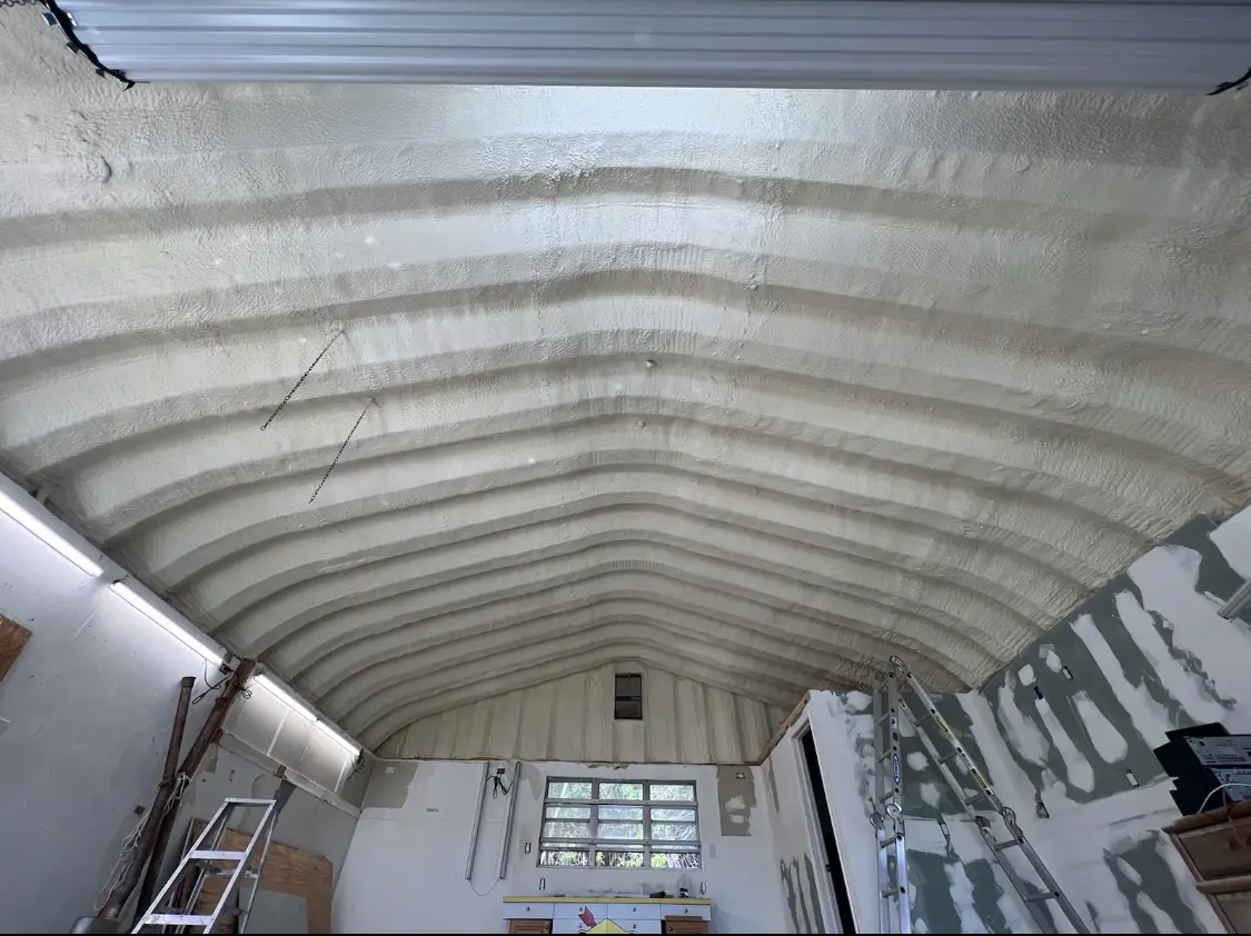 Spray polyurethane foam applied to the underside of a metal roof deck in Lago Vista
